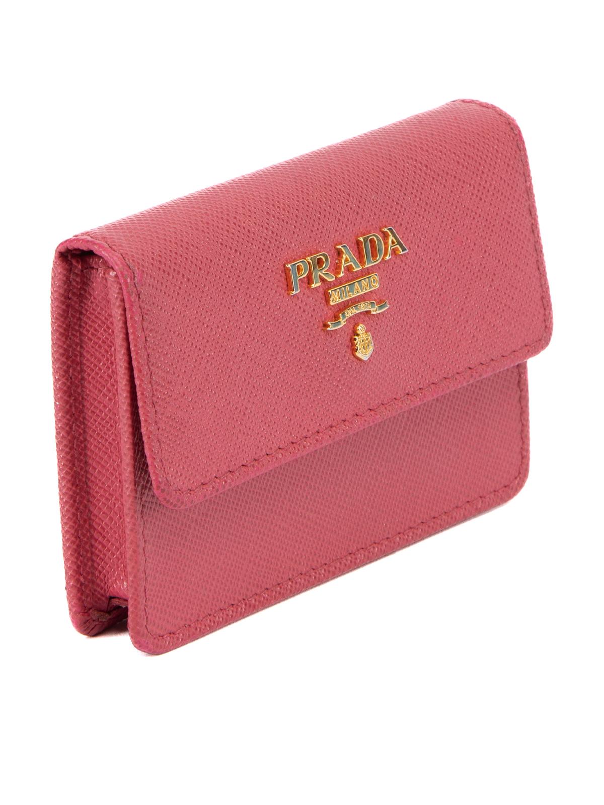 CONDITION is Very good. Minimal wear to coin purse is evident. Minimal wear to leather exterior and the gold logo on this used Prada designer resale item. Details Pink Berry Leather Gold tone hardware Flap Button fastening Made in Italy Composition