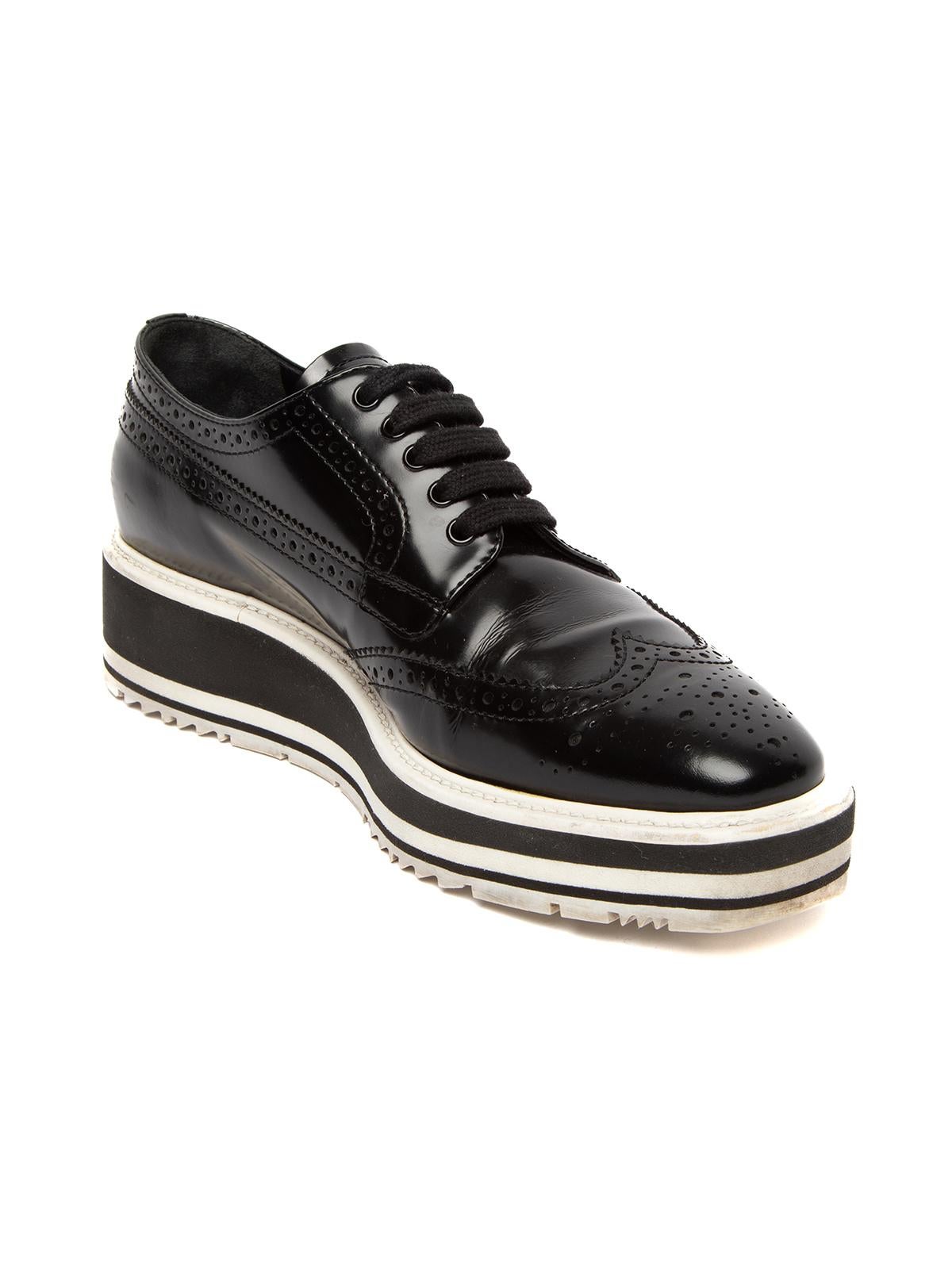CONDITION is Good. Natural creasing of leather, scuffs and marks are evident on mid sole and wear on sole of these used Prada designer resale brogues. Details Black leather brogues with oversized platform sole Almond-toe with brogue detailing