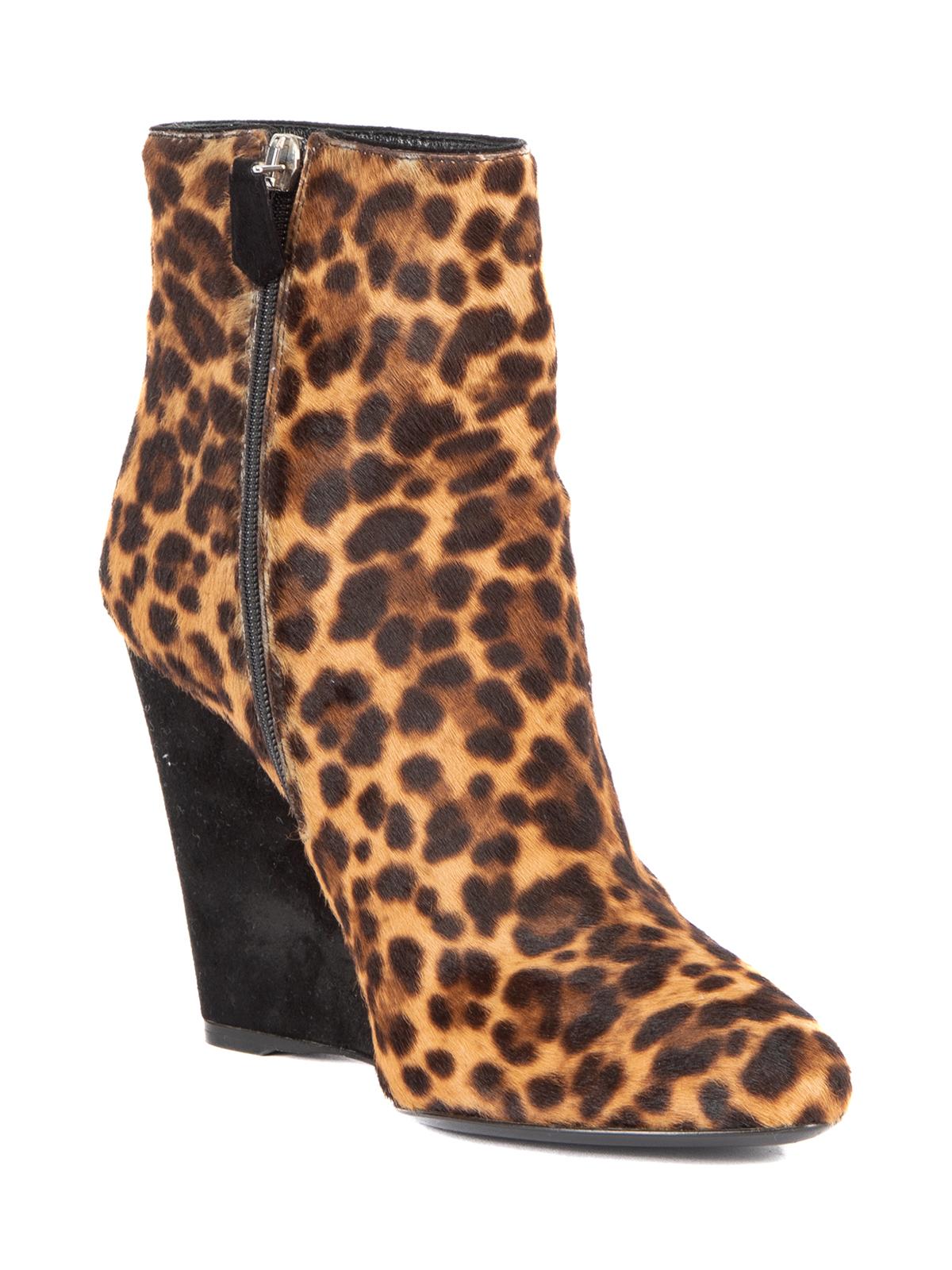 CONDITION is Very good. Hardly any visible wear to boots is evident on this used Prada designer resale item. Details Leopard print Pony hair calfskin Black suede wedge heel Point toe Side zip with black suede tag Comes with original Prada dust bags