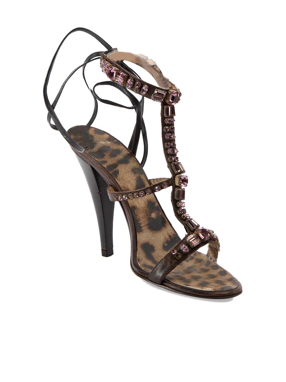 CONDITION is Very good. Minimal wear to heels is evident. Wear to inner soles is seen on this used Roberto Cavalli designer resale item. Details Brown Leather Strappy sandals Peep toe High heel Purple gemstone embellished straps Tie straps closure