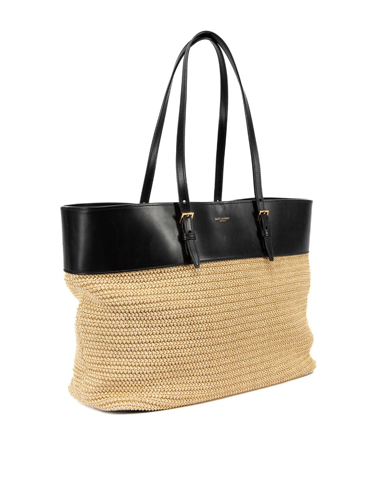 CONDITION is Very good. Hardly any visible wear to bag is evident on this used Saint Laurent designer resale item. Details Multicolour- Beige and black Raffia and leather Tote bag Medium 2x Buckle adjustable leather top handle Black leather trim on
