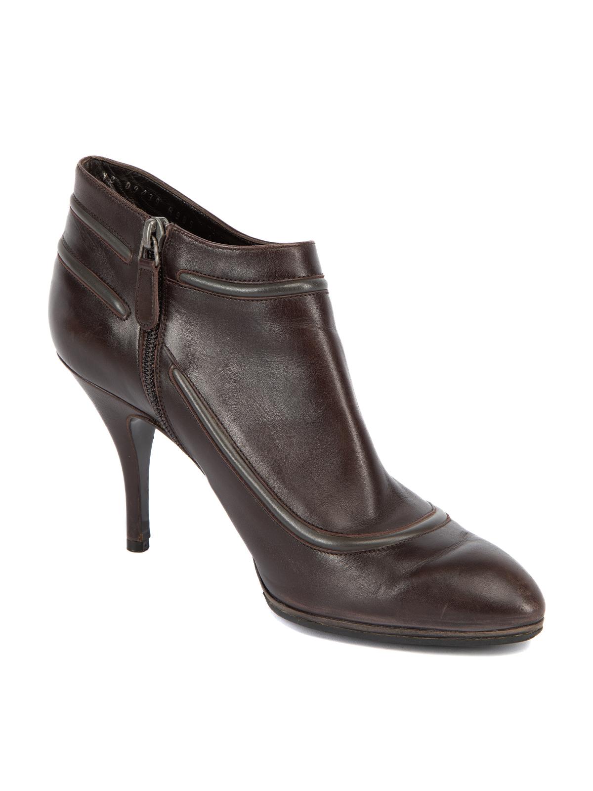 CONDITION is Very good. Minimal wear to heels is evident. Some scuff marks are visible to leather exterior, mainly to the toes on this used Salvatore Ferragamo designer resale item. Details Brown Leather Ankle boots Pointed toe High heel Black