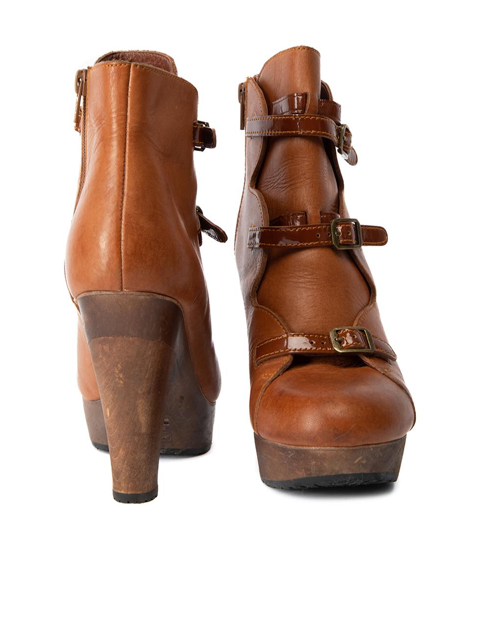 CONDITION is Very Good. Minimal wear to boots is evident. Minimal wear and creasing can be seen on the exterior leather fabric to this See by Chloé designer resale item. Details Brown Leather Ankle boots Round toe Platform high wooden heel Buckled