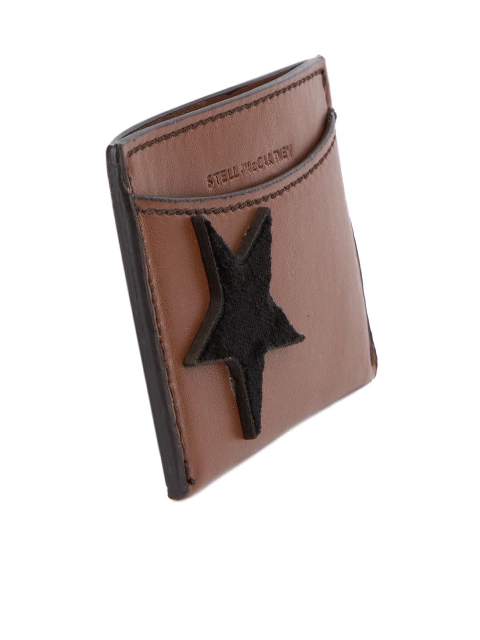 CONDITION is Very good. Hardly any visible wear to card holder is evident on this used Stella McCartney designer resale item. This item comes with original box. Details Brown Leather Cardholder Black velvet star design Stella McCartney logo 3x Card