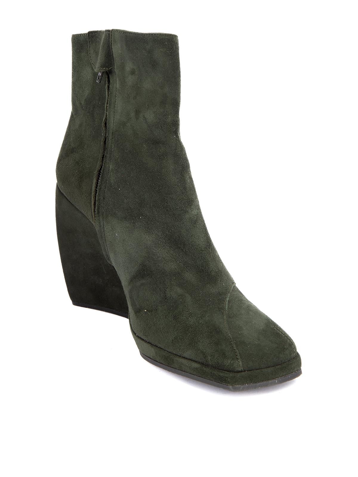 CONDITION is Very good. Minimal wear to heels is evident. Minimal wear to suede exterior on this used Stephane Kélian designer resale item. Details Green Suede Ankle boots Square toe Wedge heel Side zip closure with snap button Leather interior Made