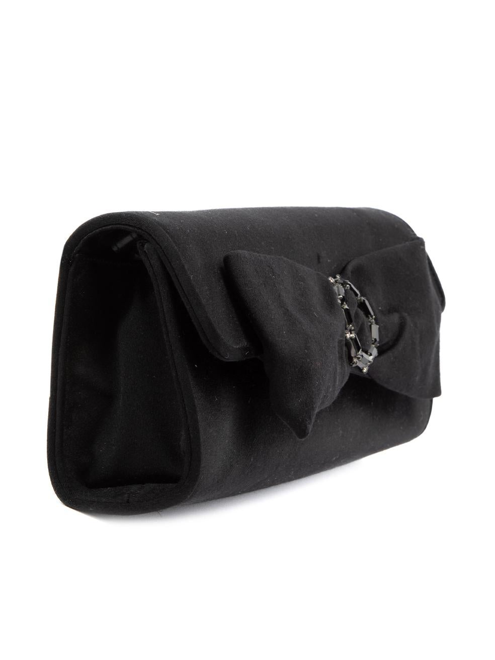 CONDITION is Very good. Hardly any visible wear to bag is evident on this used Stuart Weitzman designer resale item. Details Black Satin Long clutch Bow accent with gemstone embellishment on flap Magnetic button closure 1x Detachable shoulder strap