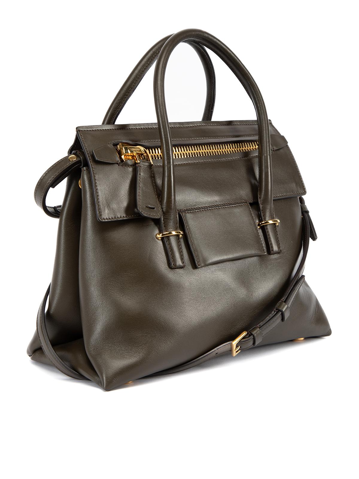 CONDITION is Very good. Minimal wear to bag is evident. Minor scratches on gold hardware on this Tom Ford designer resale item. This item comes with dust bag. Details Brown Leather Top handle bag Front flap with zip pocket TF logo on front 2x Padded