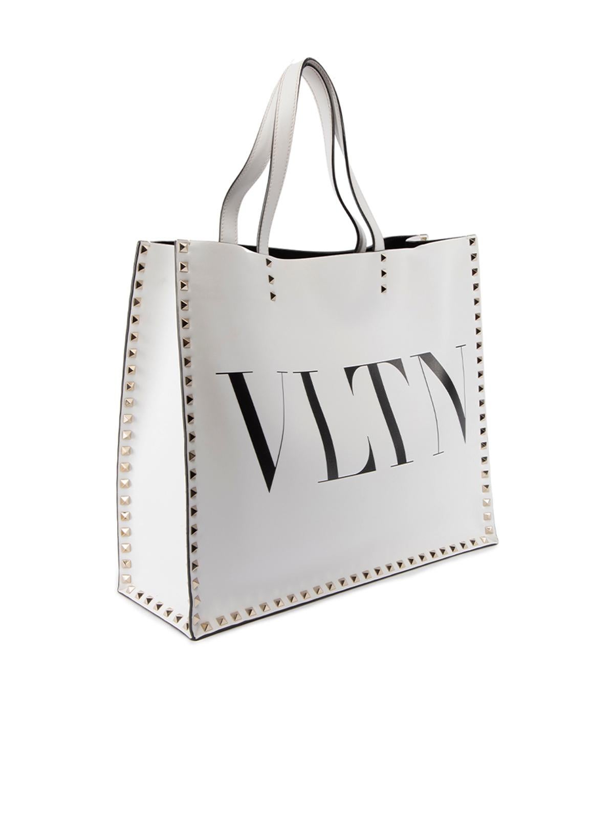CONDITION is Very good. Minimal wear to bag is evident. There a few light marks seen at the back and bottom of bag on this used Valentino designer resale item. This item comes with the original dustbag. Details White Leather Tote bag Silver tone