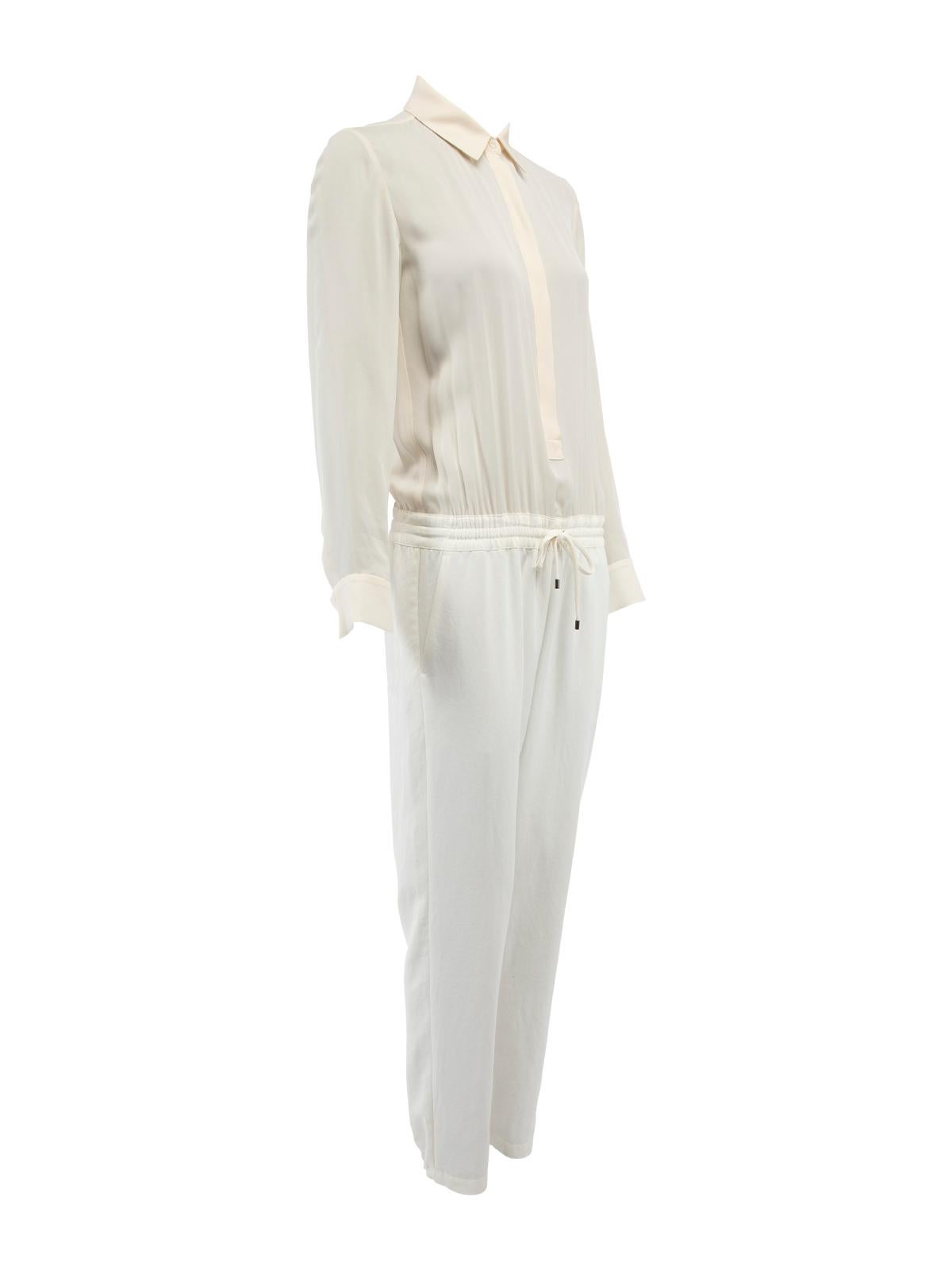 CONDITION is Very good. Minimal wear to jumpsuit is evident. Minimal marks seen to the trouser turn-ups on this used Vince designer resale item. Details Cream Silk Jumpsuit Long sleeves Collared Button up top Buttoned turn-ups Elasticated on