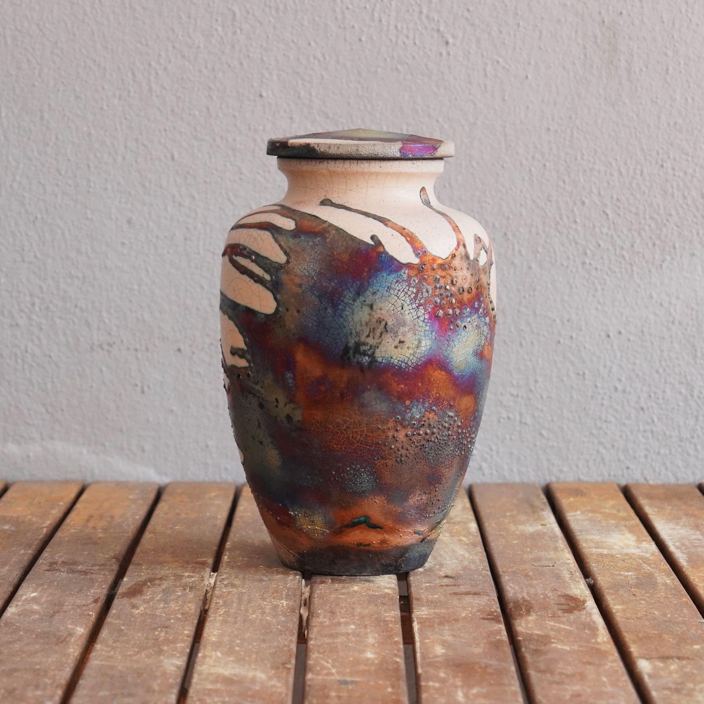 Omoide ~ (思い出) - memories.
 
The passing of a loved one will always be a defining moment in a person's life. The Omoide Urn is a one of a kind ceramic piece that offers a focal point to reminisce on the mememories left behind by your loved