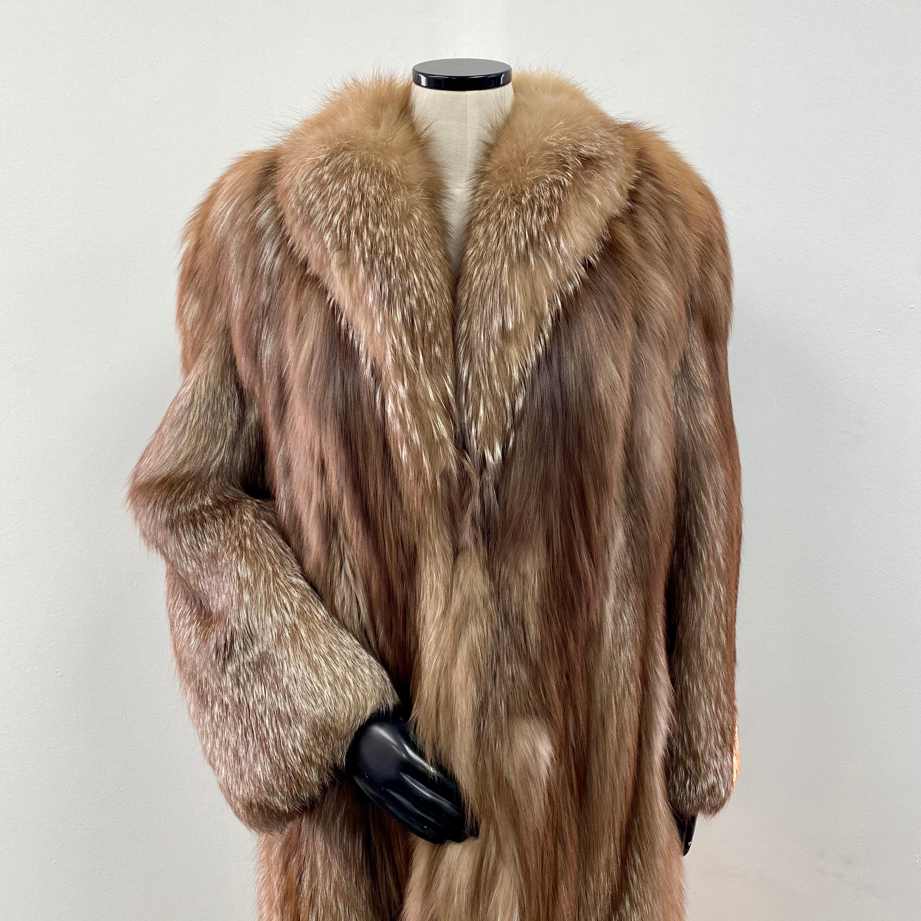 PRODUCT DESCRIPTION:

Brown dyed silver fox fur mid-length coat

Condition: Pristine

Closure: German hooks

Color: Brown and Silver

Material: Silver fox fur

Garment type: Mid length Coat

Sleeves: Straight

Pockets: Two slit pockets

Collar: