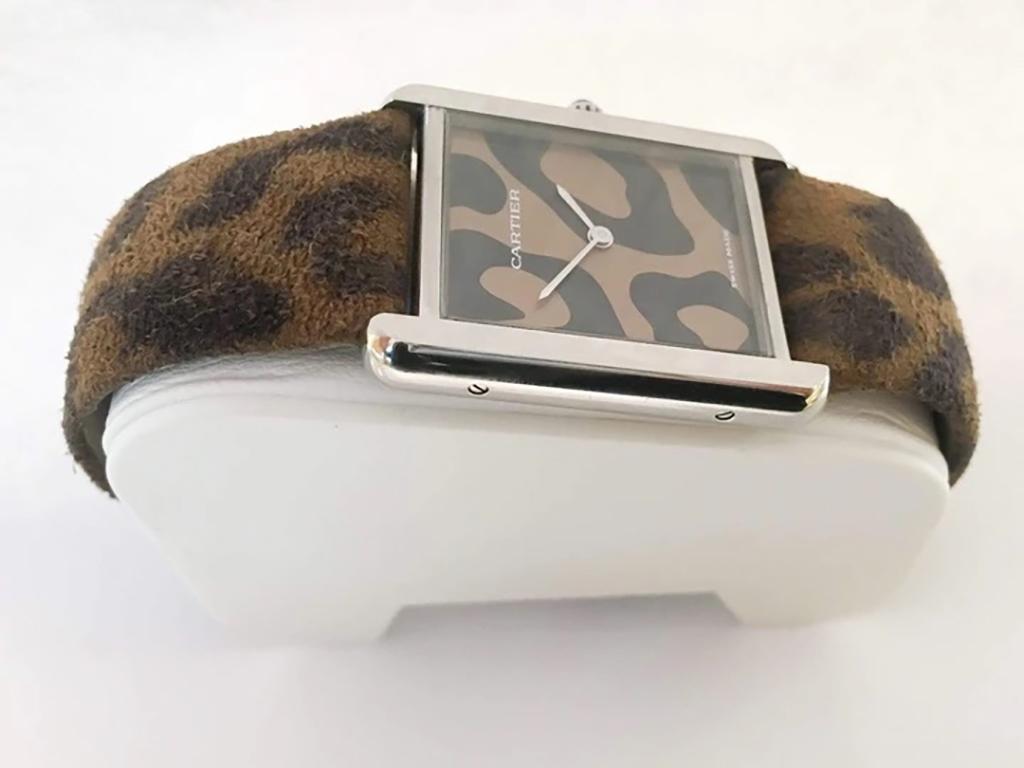 Pre-Owned Cartier Limited Edition Tank Solo Steel Leopard Print Strap & Dial Quartz #3169

Serial no: 3169
Movement: quartz battery
Case material: stainless steel
Condition: like new excellent pre-owned
Case measurements: 27mm x 34mm x 5mm (not