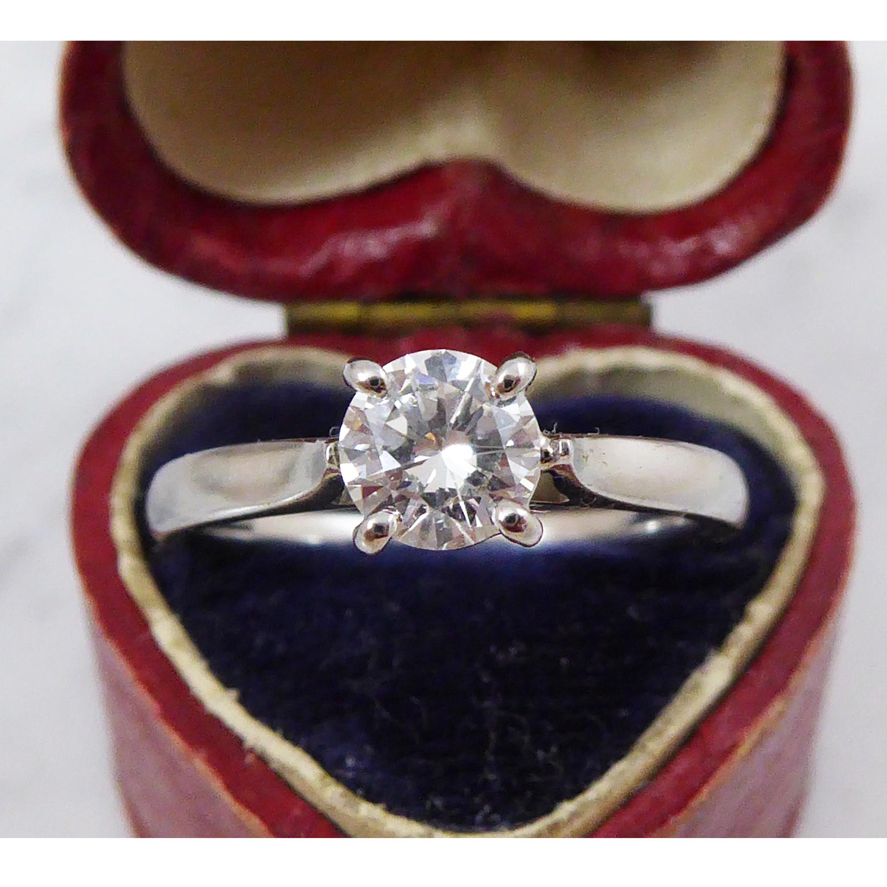 Fabulous single stone engagment ring sporting a round brilliant cut diamond, 0.52ct and with colour and clarity assessed as E/F and VS2 respectively.  

Measuring approx. 5.14mm diameter, the diamonds is four claw set to a basket mount, with