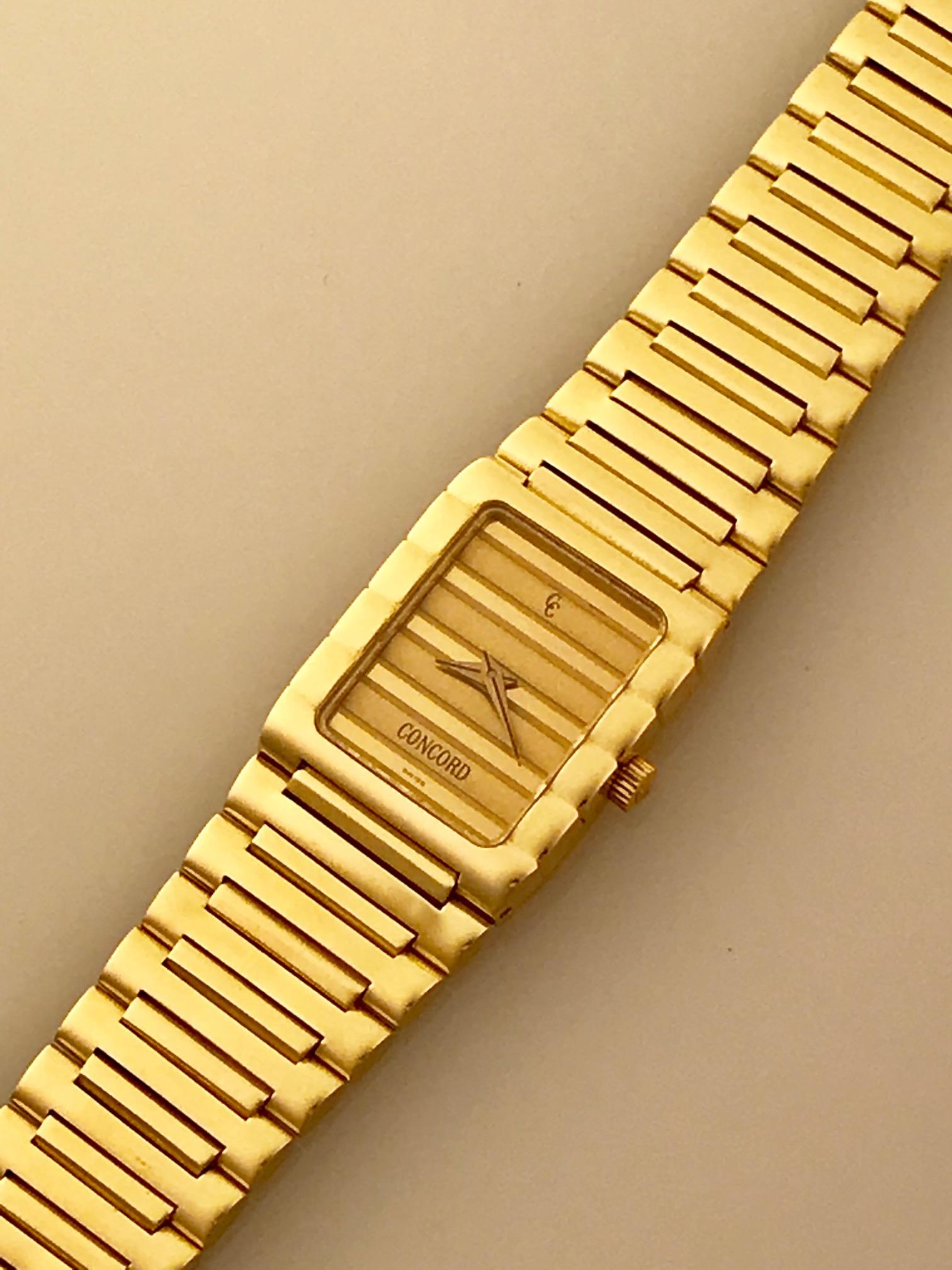 Contemporary pre-owned Ladies Concord Dameuri quartz in lovely condition. This watch is made of 18k yellow gold and houses a quartz movement. The bracelet and dial boast a unique horizontal pattern that integrates throughout the watch. Substantial
