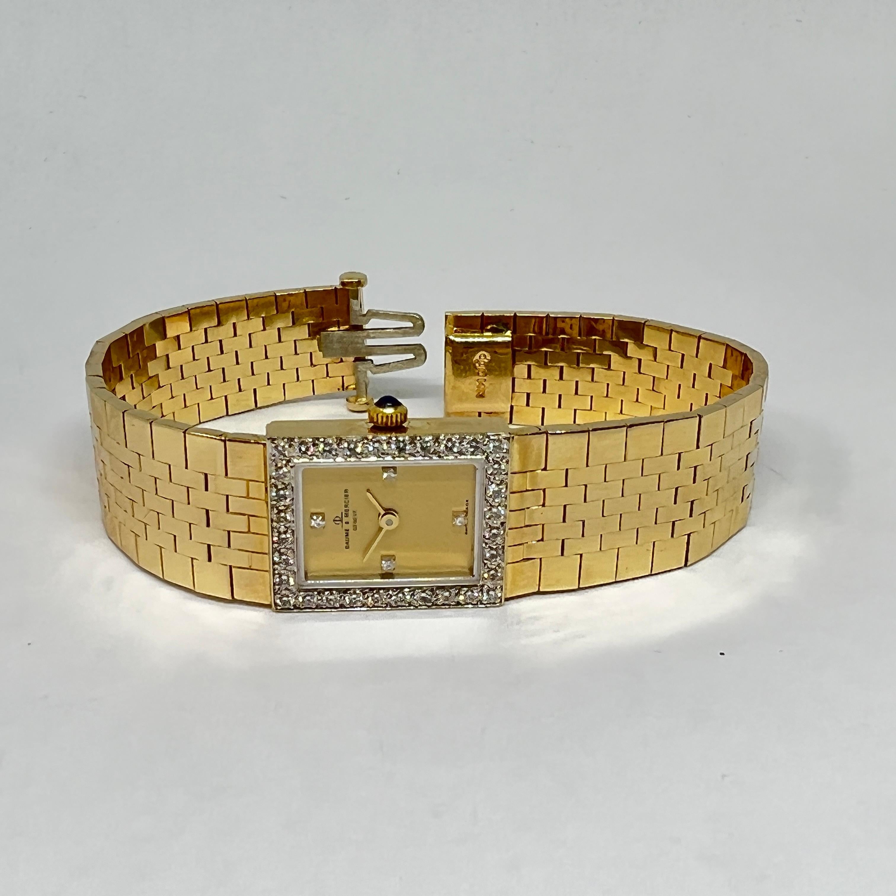 Montre Baume & Mercier Classic Vintage Diamond Mesh pour dames, d'occasion. La montre est conçue en or jaune 14 carats, le cadran mesure 15 x 18 mm avec une lunette et des index en diamant pavé, un cadran à finition mate en tonalité or, un bracelet