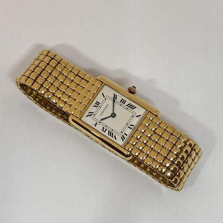 Rare pre-owned authentic Louis Cartier timepiece designed in solid 18 karat yellow. The watch measures 30.50 x 23.50mm, 7 1/2