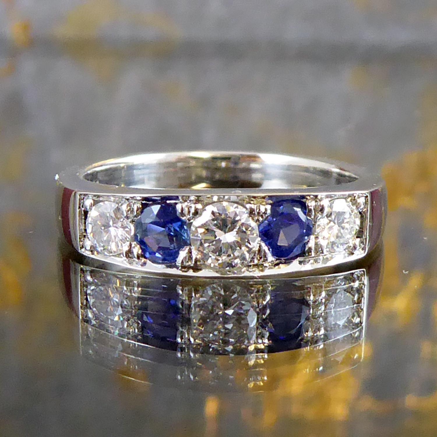 Modern Pre-Owned Sapphire and Diamond Eternity Ring in Platinum