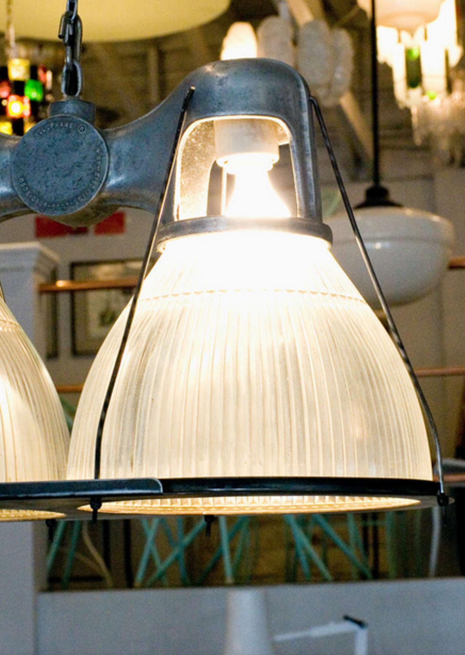 Produced by Holophane, the preeminent name in commercial lighting since 1898, this 1940s-era double fixture has recently been inspected and rewired. Its Industrial appearance looks great in lofts and lends a Machine Age counter-note to any stylish