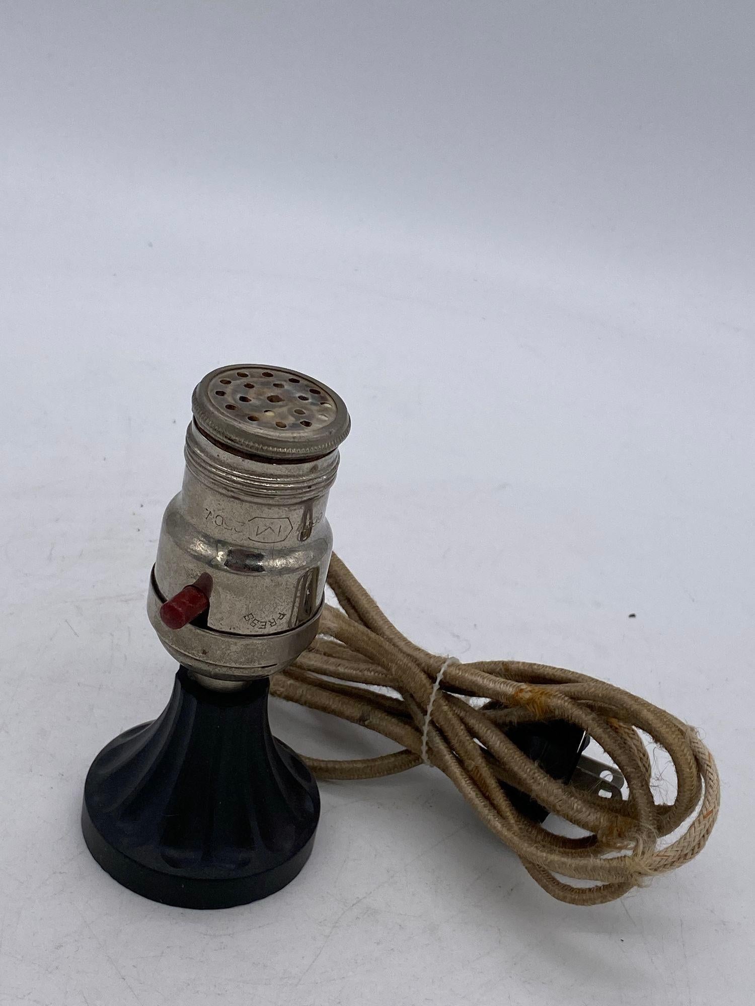 Pre-War Electric Lamp Base Lighter, featuring a modified lamp socket fixed with an electric lighter similar to car light.

Circa 1930