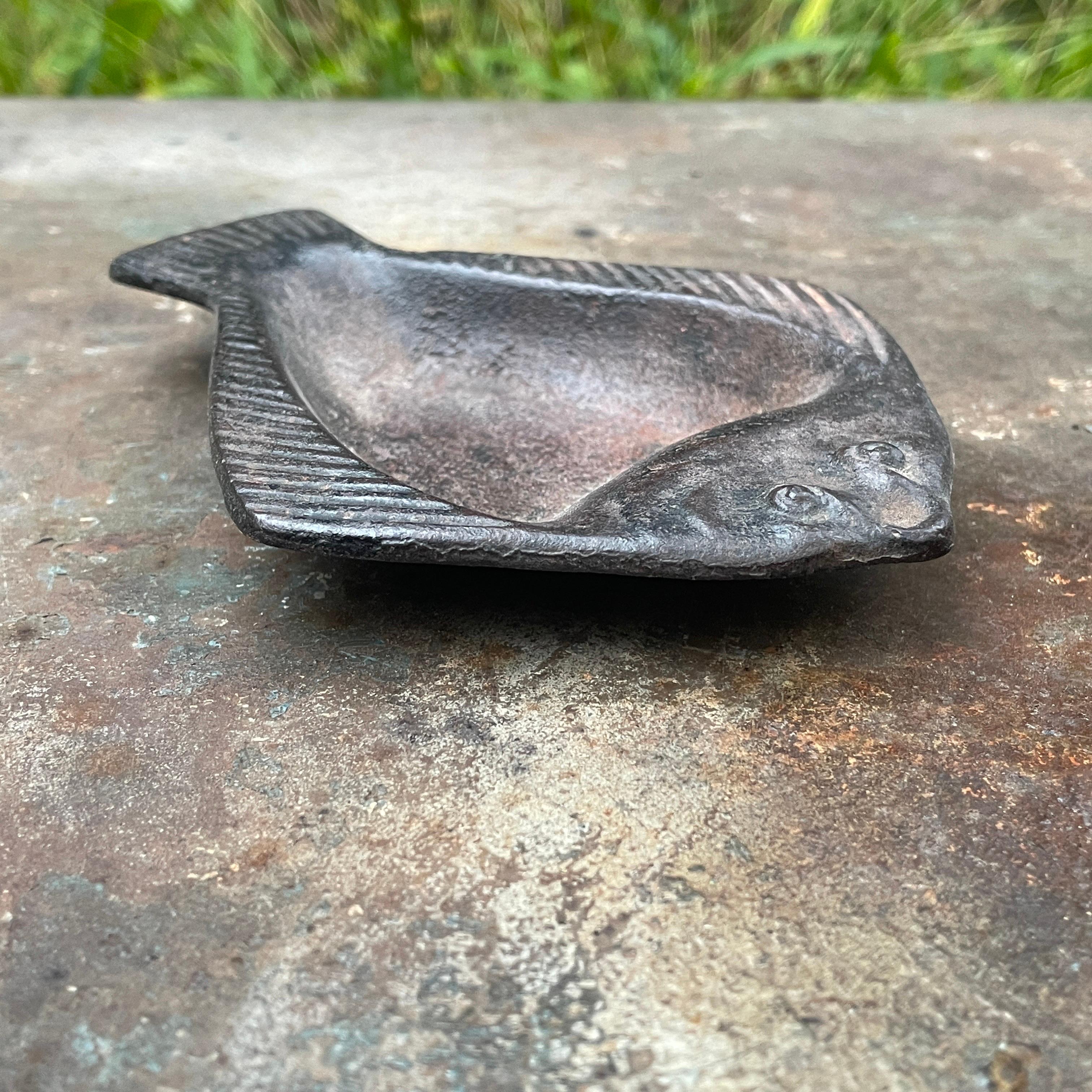 The flounder symbolizes many things among many different cultures; from good luck, to adaptability, to a bringing of change, or new life. Good condition; No chips and no cracks to this thin and highly detailed iron casting, some light oxidation.