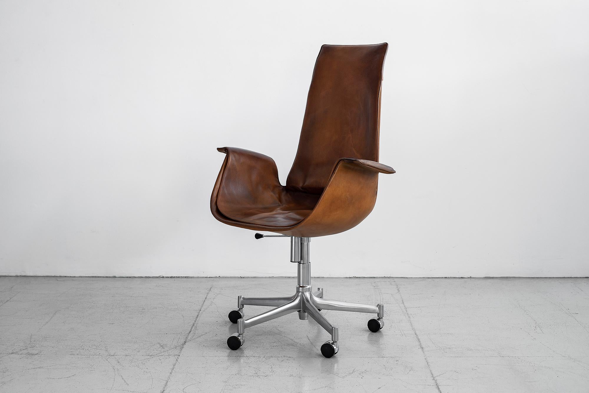 Classic Preben Fabricius bird office chair with 5 star rolling base and casters.
Carmel brown leather maintains wonderful patina. Swivels and rolls well on original casters. Additional chair in black also available.