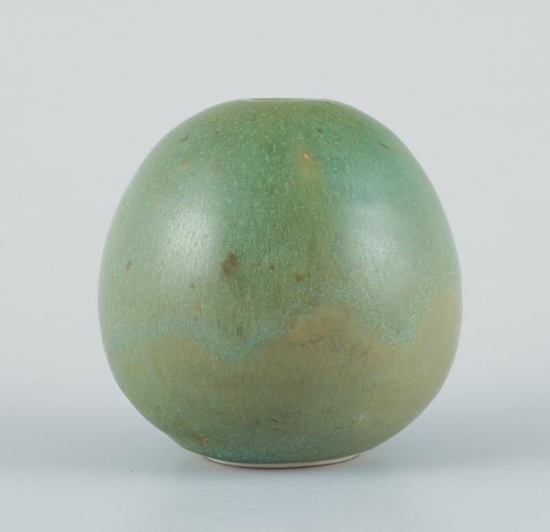 Preben Brandt Larsen, Danish ceramist. 
Unique ceramic vase with green-toned glaze. Egg-shaped.
From the 1980s.
Signed PBL, Denmark.
In perfect condition.
Dimensions: Height 8.5 cm x Diameter 8.5 cm.