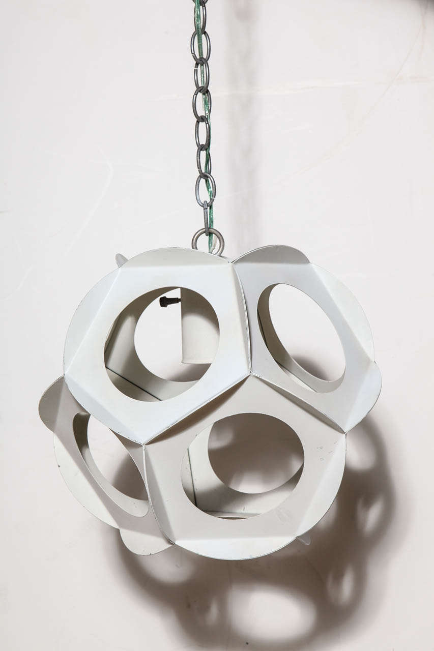 Danish Mid-Century Modern adjustable, nine sided off white enameled steel hanging lamp, in the manner of Preben Dahl for Hans Følsgaard. Featuring a geometric form with nine round cut-outs with lipped surround. Standard socket. Utilizes large