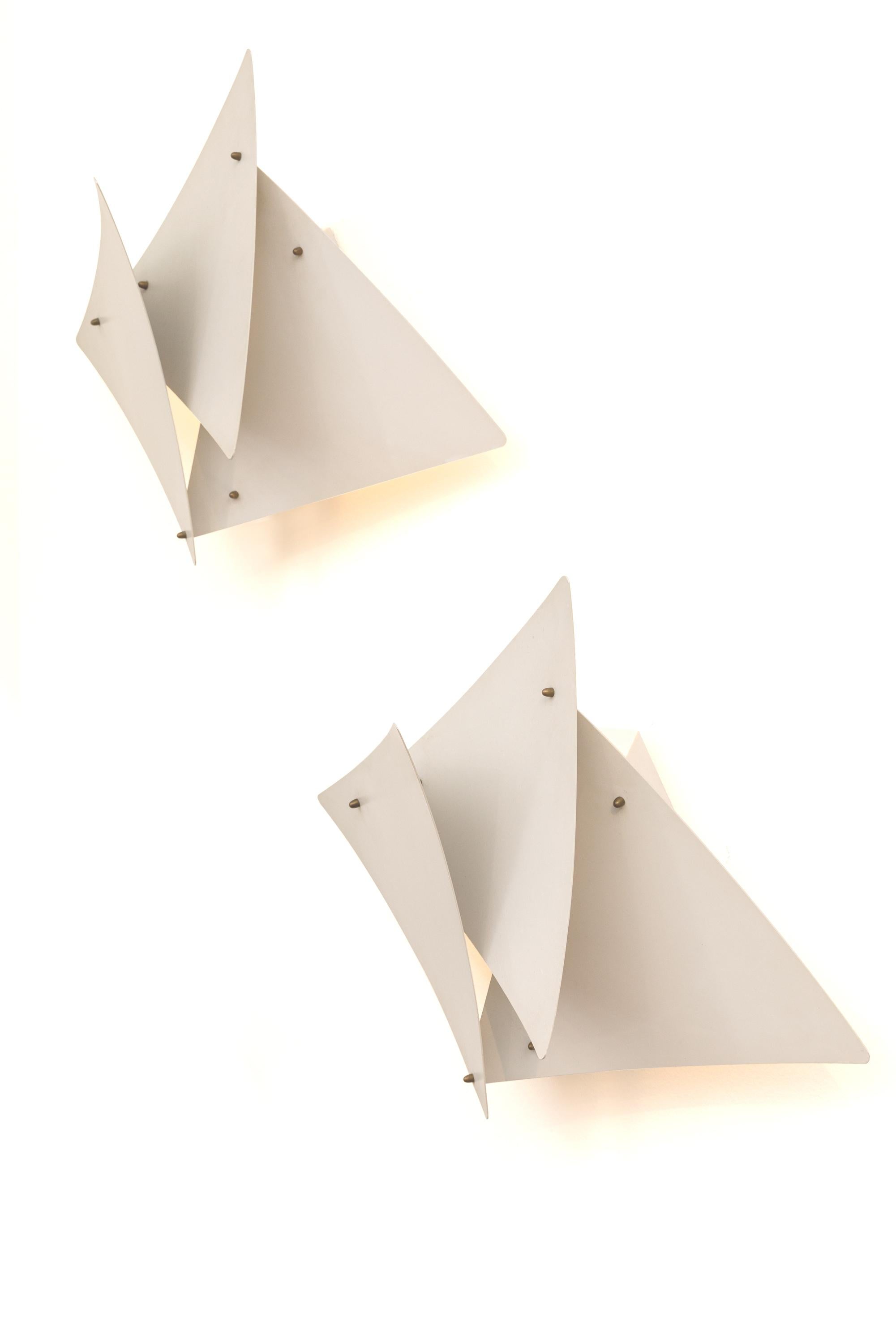 Preben Dahl's Symfoni lights are immediately recognizable for their distinctive design. These sconces are rare due to the untypical subtle petal like panels not usually seen on his other lights.