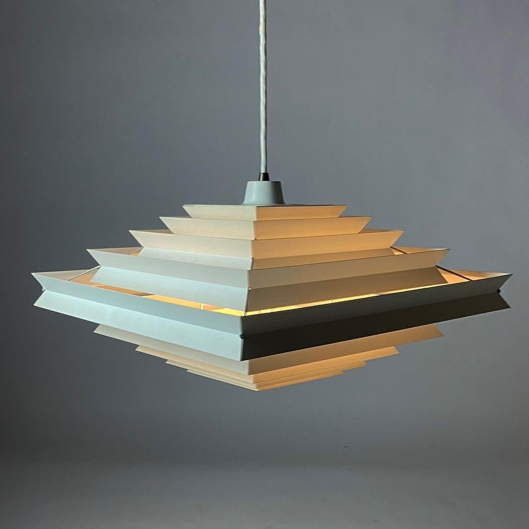 Iconic, beautiful, Minimalist, stylish, complex, contemporary, and the list of compliments could go on.

This HA 25 model also named “Vinkel-lampen” Angle-lamp was designed by the brilliant lighting designer Preben Dal. Why Angle-lamp, because all