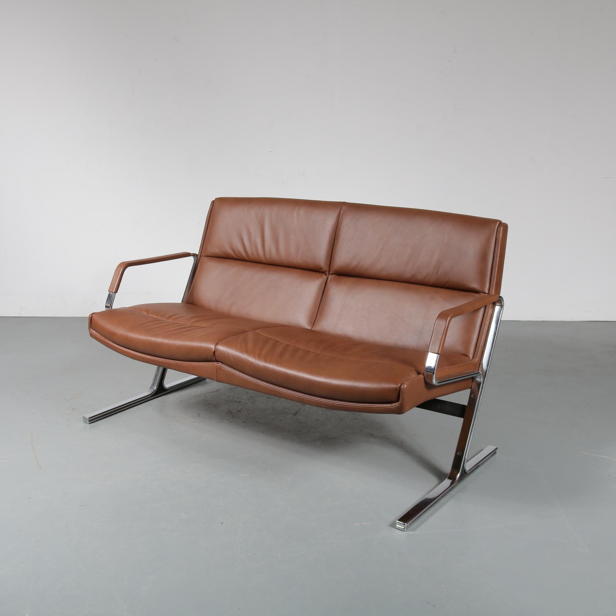 A beautiful two-seat sofa designed by Preben Fabricius, manufactured by Walter Knoll in Germany, circa 1970.

This stunning piece is newly upholstered in top quality brown leather. This contrasts beautifully to the bright chrome-plated metal