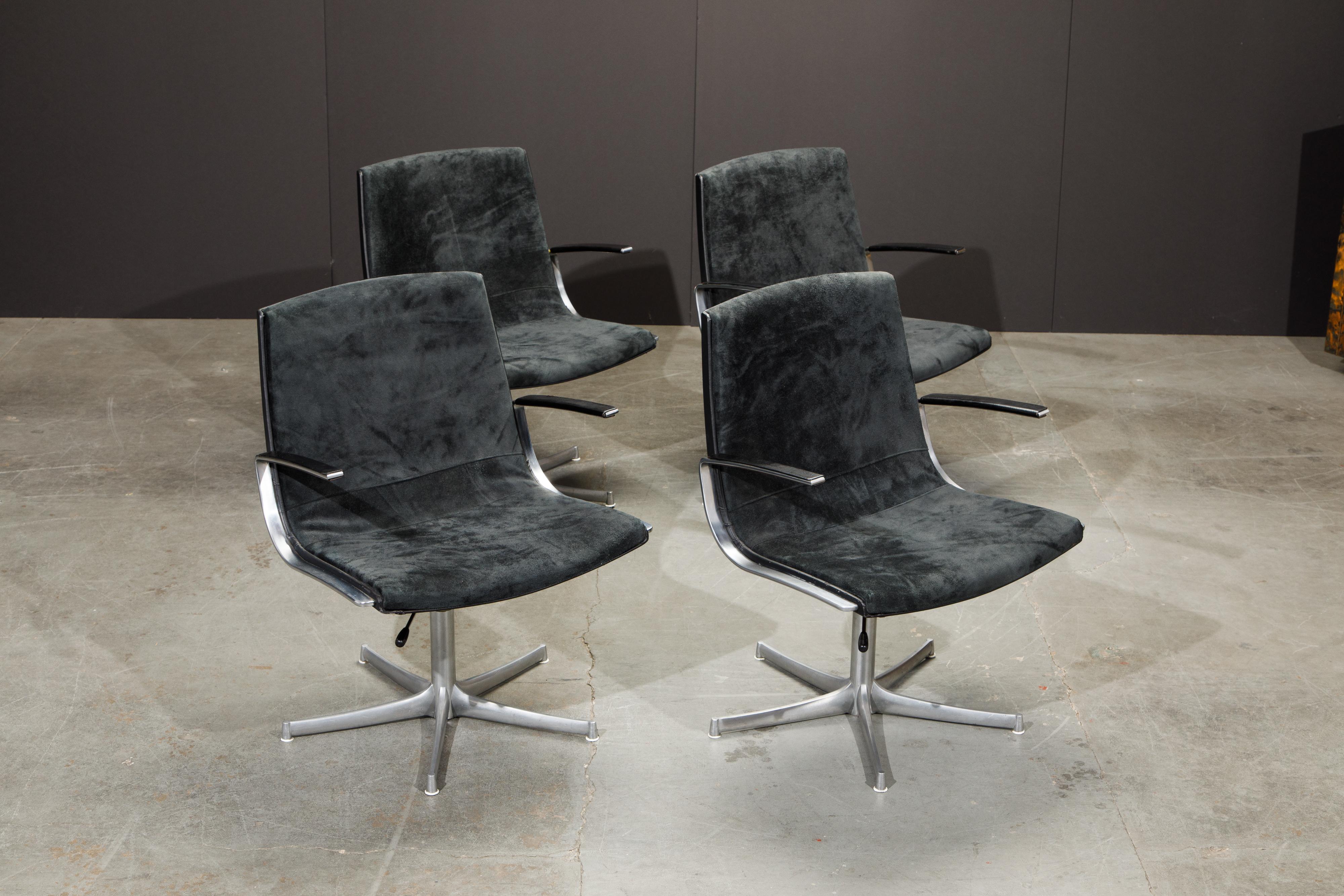 This incredible set of four swivel lounge chairs by Preben Fabricius and Jorgen Kastholm for Walter Knoll (Germany) featuring soft luxurious charcoal black suede leather seats and contrasting black leather arms, back and trim with matte chromed