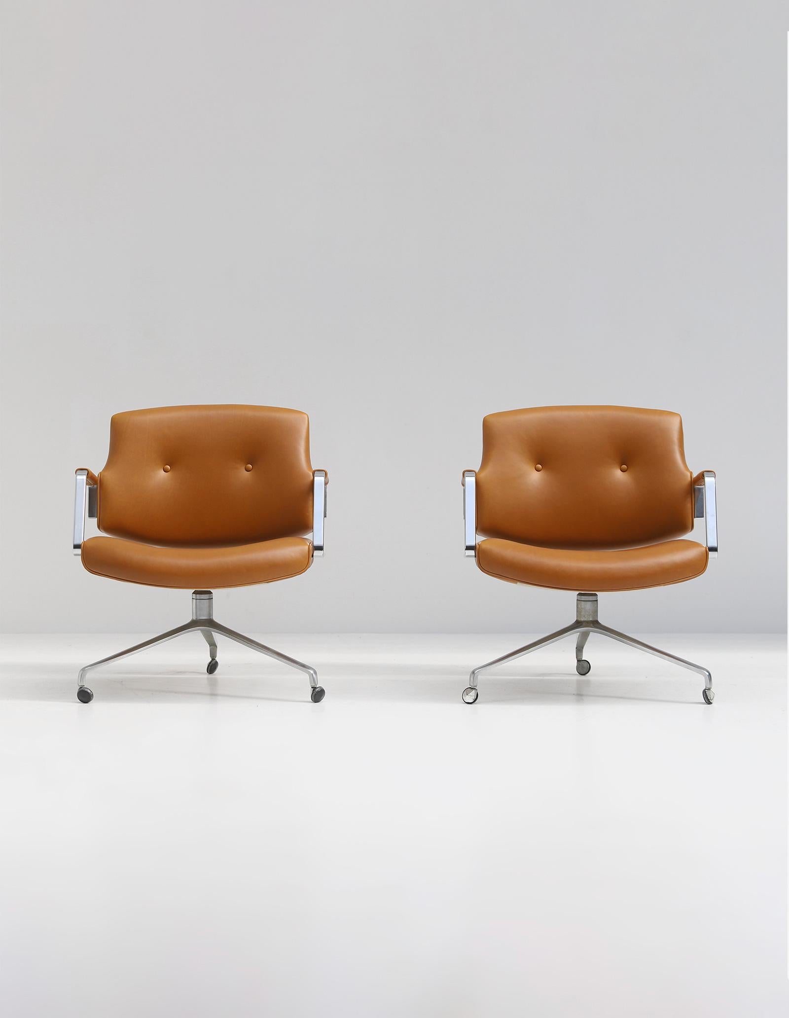 Rare conference or office FK-84 armchair designed by Preben Fabricius and Jorgen Kastholm. Manufactured by Kill International, Denmark 1970s. Both chairs stand in a well preserved condition and are reupholstered in a quality cognac colored leather,