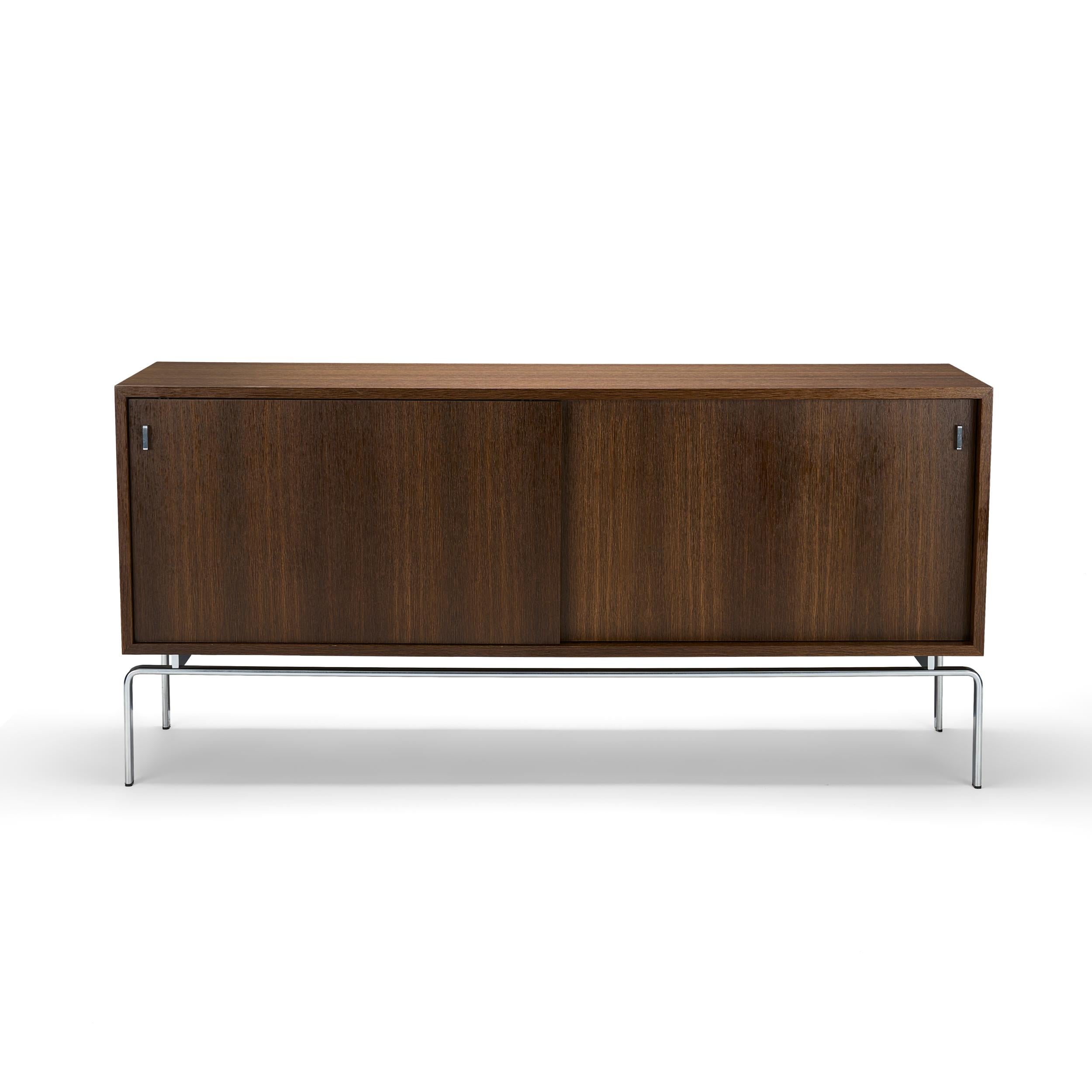 The FK 150 Sideboard was designed in 1973 by Jorgen Kastholm and is today being produced at the same factory, on the same tools as back in the seventies. The sideboard is a perfect room divider as it is veneered on all surfaces on the outside as