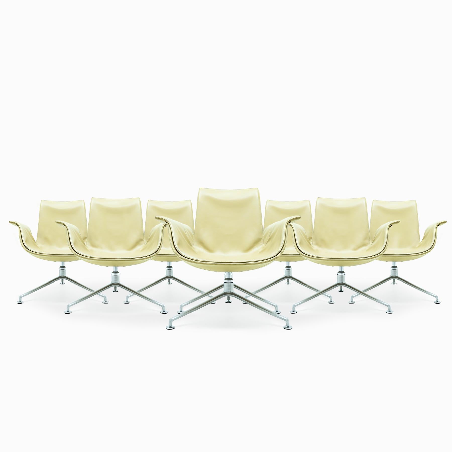 An exceptional set of 8 Danish Mid Century Preben Fabricius and Jørgen Kastlhom FK Lounge Chairs, model FK 6727-3G for Walter Knoll, in a light biscuit coloured leather with satin polished aluminium 3 star base. The price is for one chair. Discounts