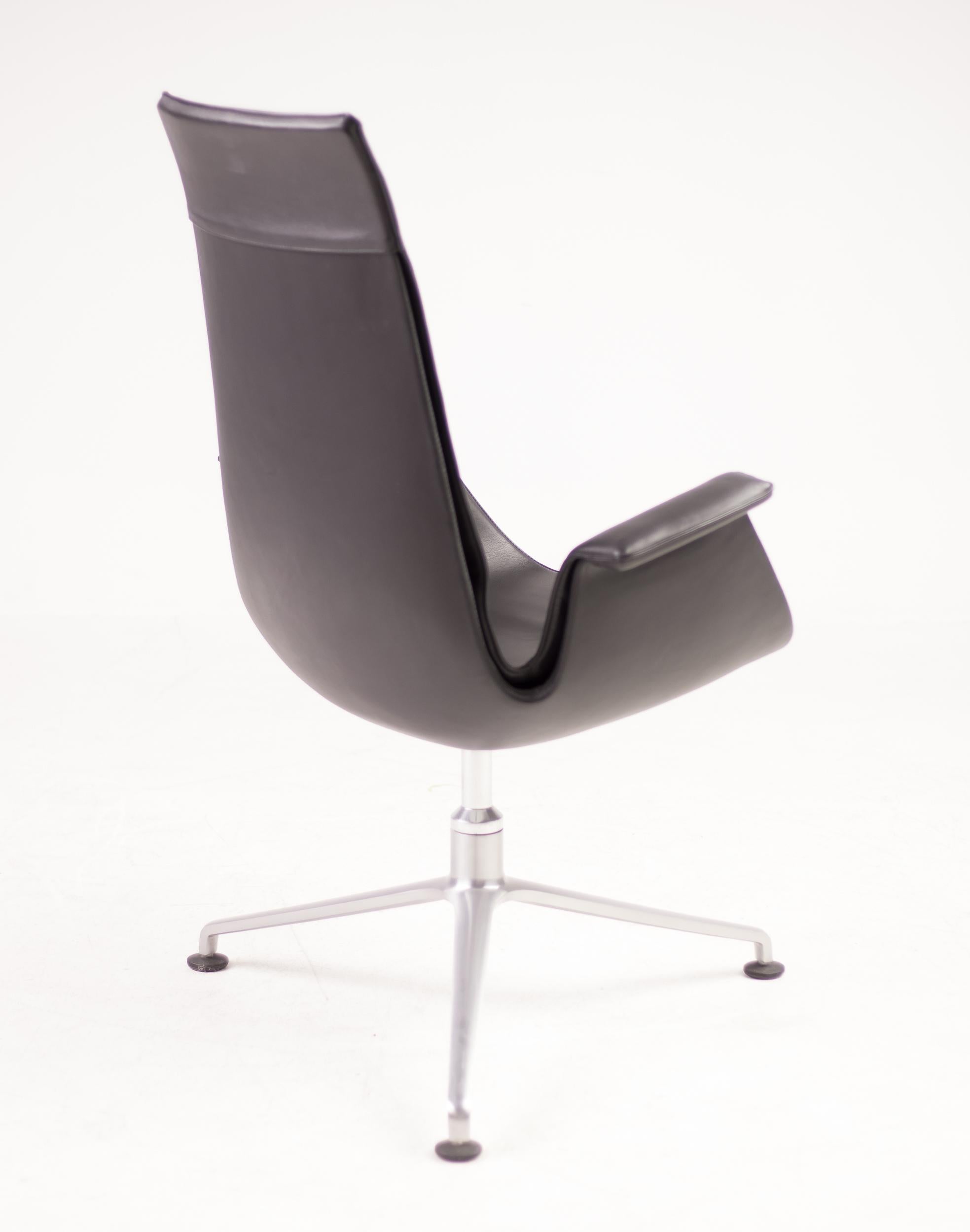 Black leather Bird chair designed by Preben Fabricius & Jørgen Kastholm for Kill International. 
Beautiful swiveling high back desk chair on tripod cast aluminum base.