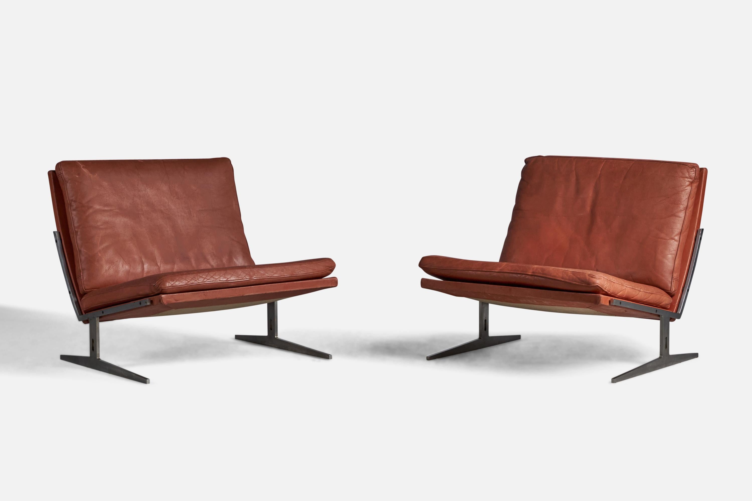 A pair of steel and red leather lounge or slipper chairs designed by Preben Fabricius & Jørgen Kastholm and produced by Bo-Ex, Denmark, 1960.

12” seat height