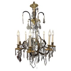 Preciosa Lighting, 8armiger böhmischer Kronleuchter aus Messing und Eisen mit handgeschliffenem Kristall