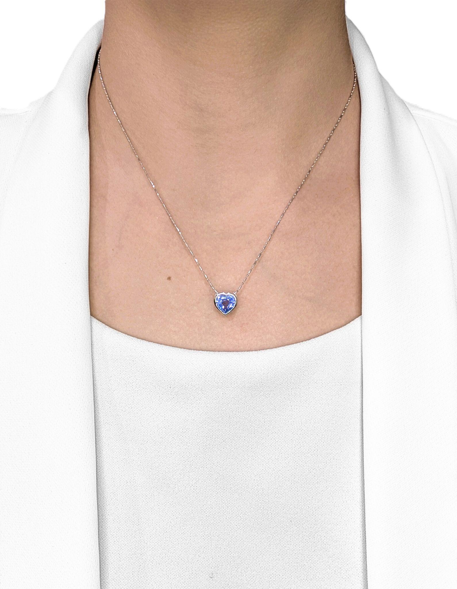 Fall in love with this enchanting heart-shaped pendant, showcasing a vivid 2.18ct natural blue sapphire that radiates depth and charm. Expertly bezel-set in sleek 18K white gold, the sapphire’s vibrant hue and unique cut make this piece a perfect