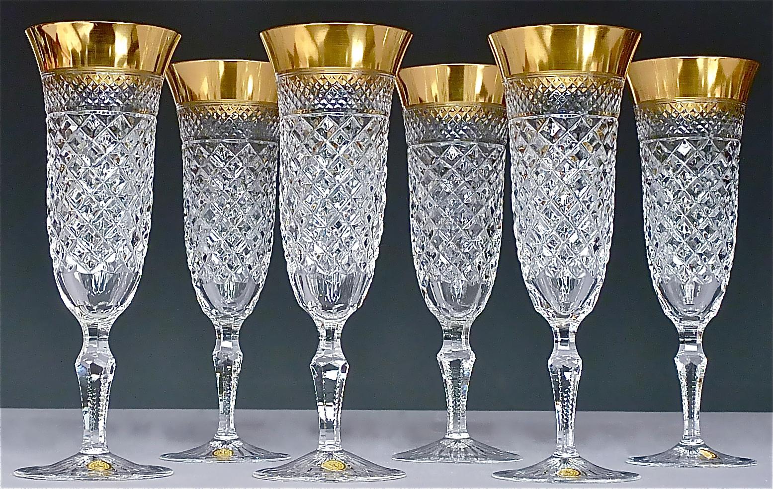 Gorgeous 20th century handcrafted faceted crystal glass set with 24 carat gold rim made by Josephinenhütte Moser circa 1960-1970 and very in the style of the exclusive french company Baccarat or Saint Louis thistle. This exquisite set of 6 champagne