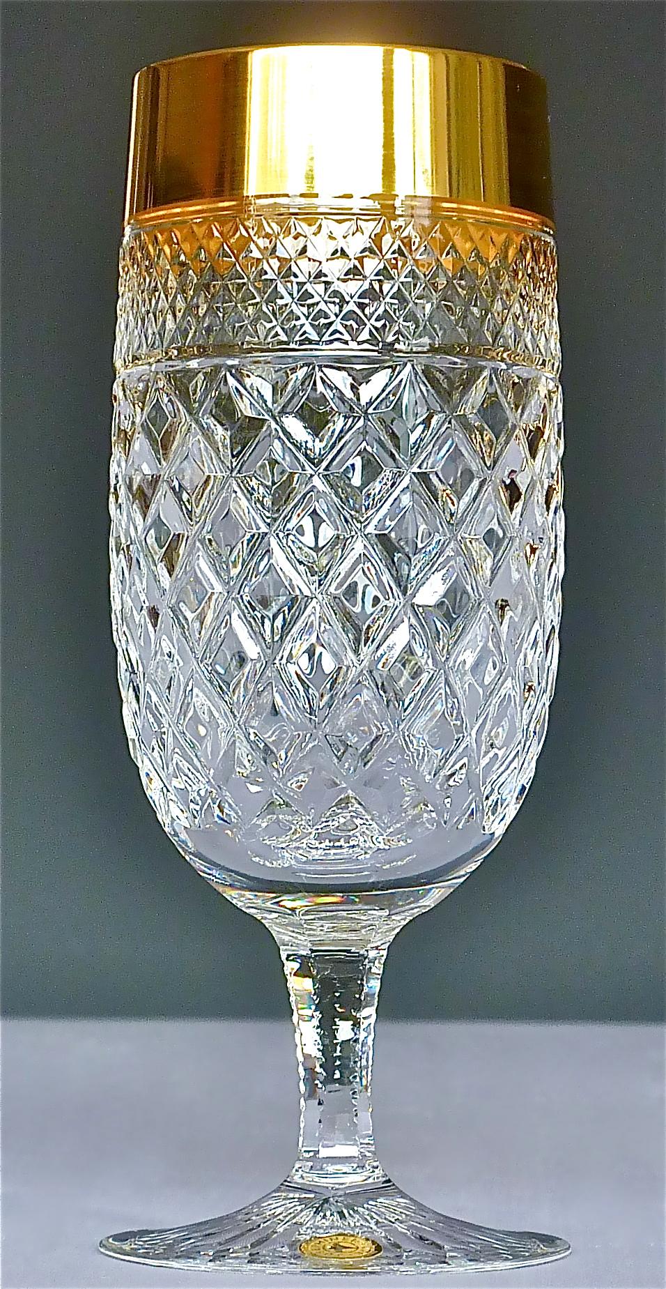 Gorgeous 20th century handcrafted faceted crystal glass set with 24-carat gold rim made by Josephinenhütte Moser, circa 1960-1970 and very in the style of the exclusive French company Baccarat or Saint Louis thistle. This exquisite set of 6 cocktail