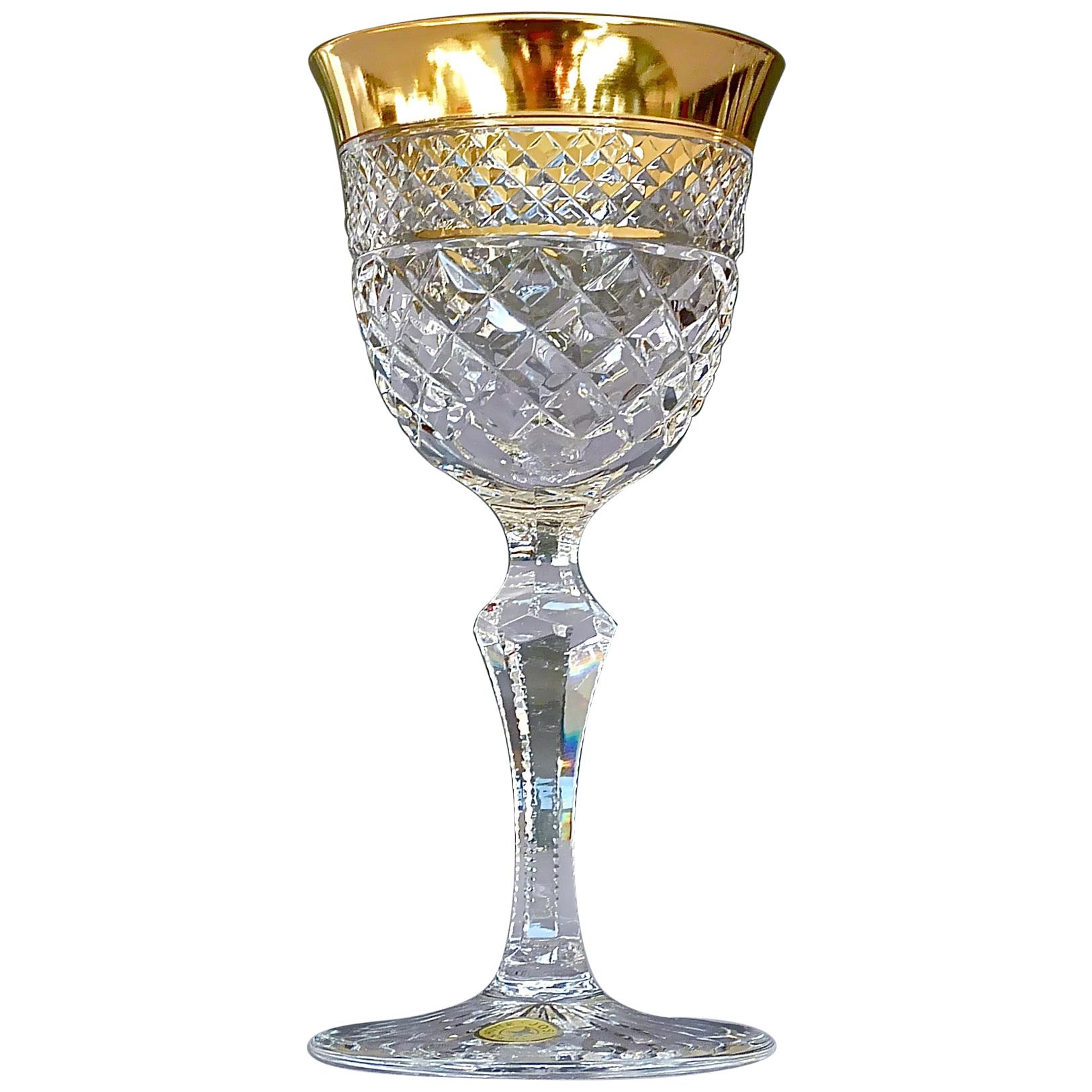 Gorgeous 20th century handcrafted faceted crystal glass set with 24-carat gold rim made by Josephinenhütte Moser circa 1960-1970 and very in the style of the exclusive French company Baccarat or Saint Louis thistle. This exquisite set of 6 dessert