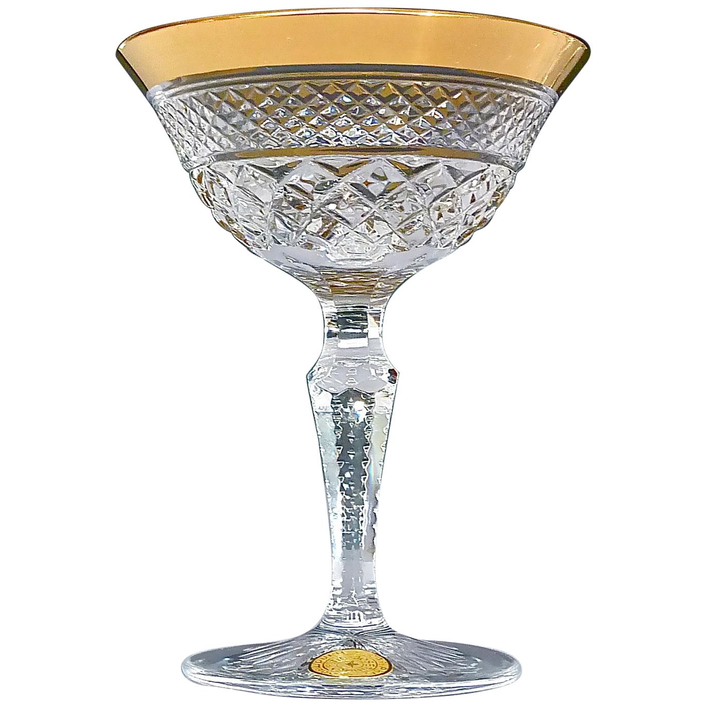 Gorgeous 20th century handcrafted faceted crystal glass set with 24-carat gold rim made by Josephinenhütte Moser circa 1960-1970 and very in the style of the exclusive French company Baccarat or Saint Louis thistle. This exquisite set of 6 liqueur