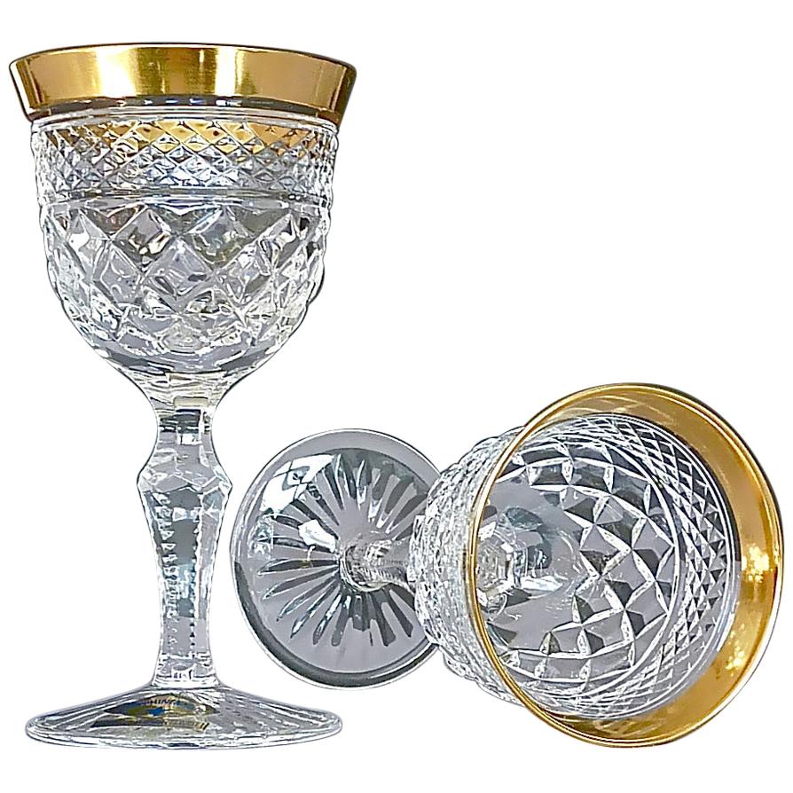 Gorgeous 20th century handcrafted faceted crystal glass set with 24-carat gold rim made by Josephinenhütte Moser circa 1960-1970 and very in the style of the exclusive French company Baccarat or Saint Louis thistle. This exquisite set of 6 schnapps