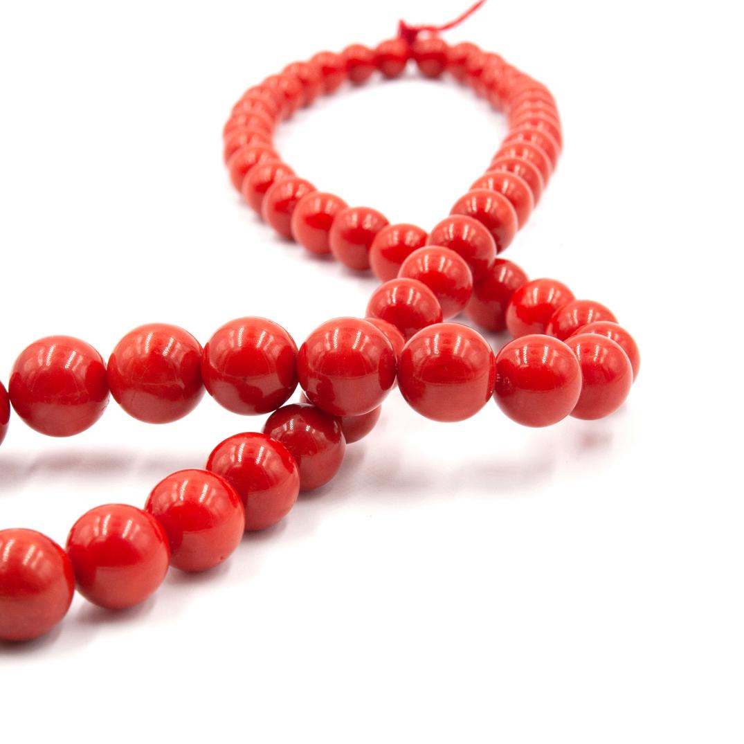 A Natural Red Coral necklace hand crafted and strung. This necklace features 57 vibrant red Coral beads, all graduating in size with the largest being 15.2 mm and the smallest being 8.2 mm. The necklace weighs 88.8 grams. This coral displays a