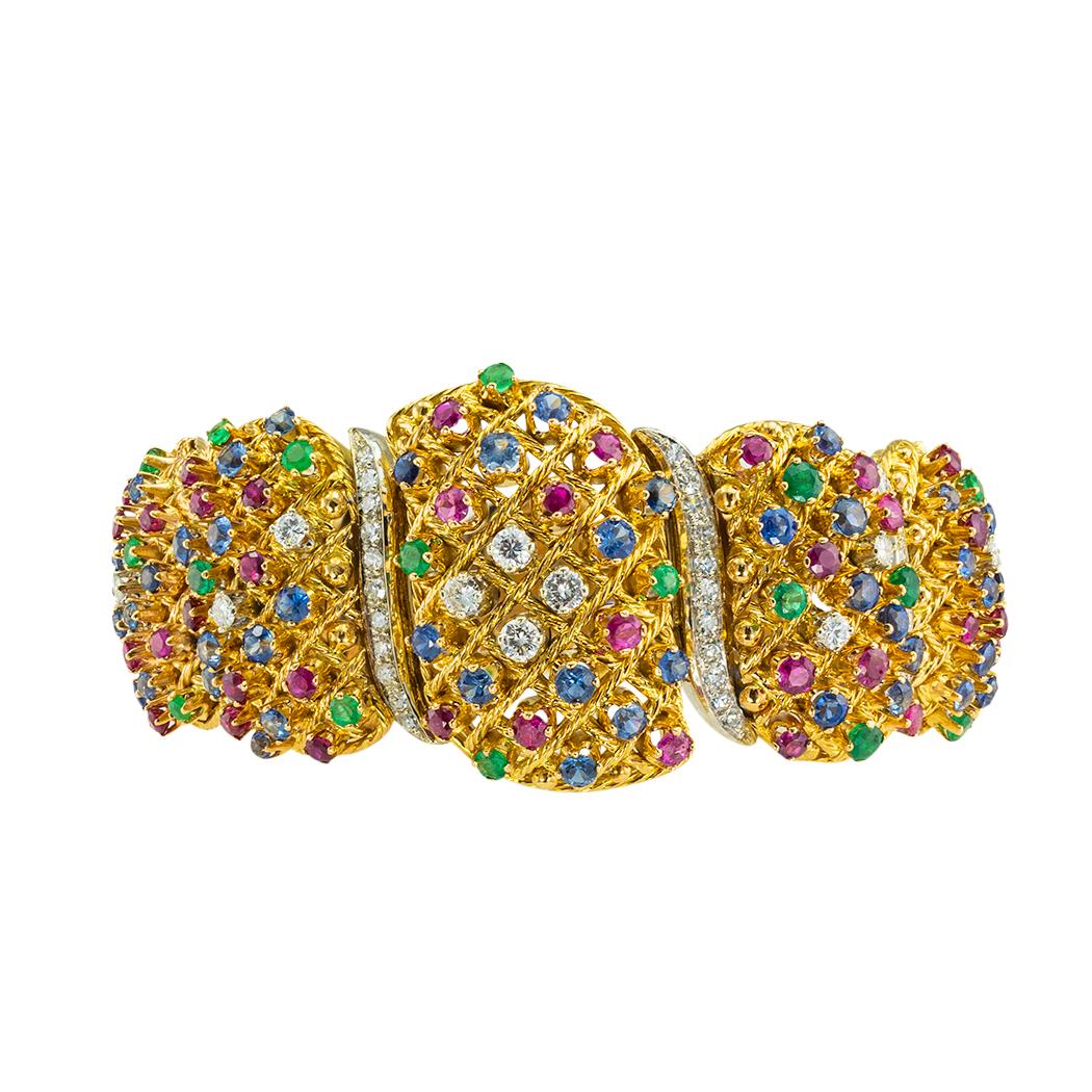 Precious gems and diamonds gold link bracelet circa 1970.  *

ABOUT THIS ITEM:  #B-DJ125D. Scroll down for detailed specifications.  This impressive bracelet is adorned with an abundance of the most precious gems known to man.  Diamonds, emeralds,