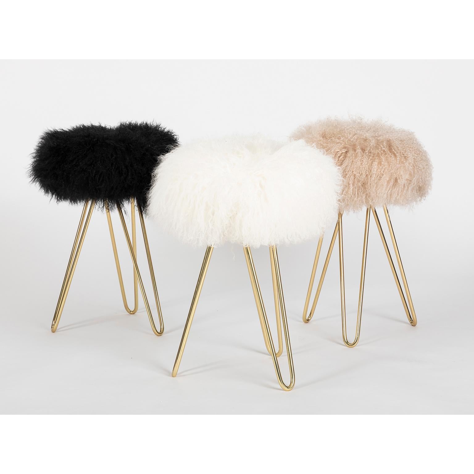 Designed by our studio, this lovely small stool that can work also as a side table.

It is an iconic and playful piece that will lighten up every room!

The feet is in solid polished brass and the upholstery in Mongolian goat fur. It is