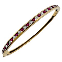 Precision Crafted Channel Set Yellow Gold Ruby and Diamond Bangle Bracelet