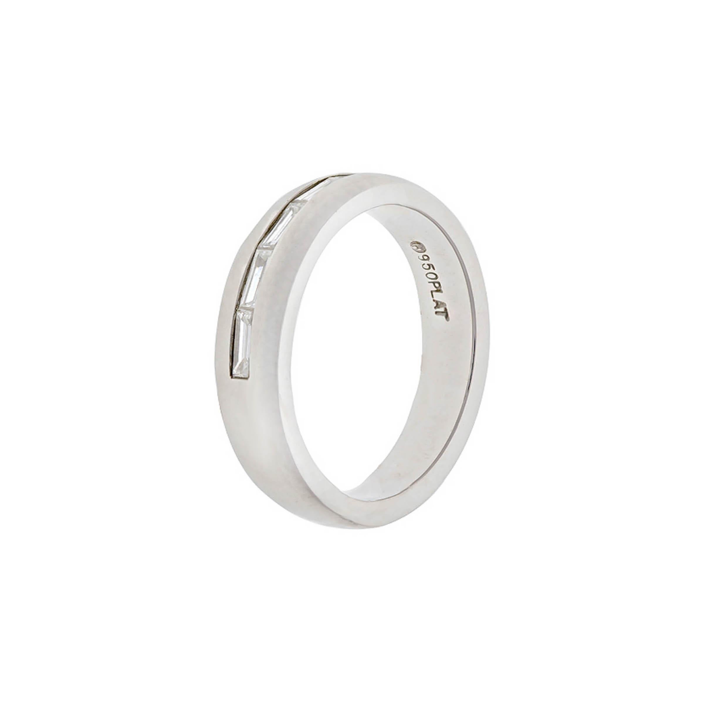 Platinum wedding band containing five baguette diamonds weighing combined 0.66 carat. G color, VS clarity.