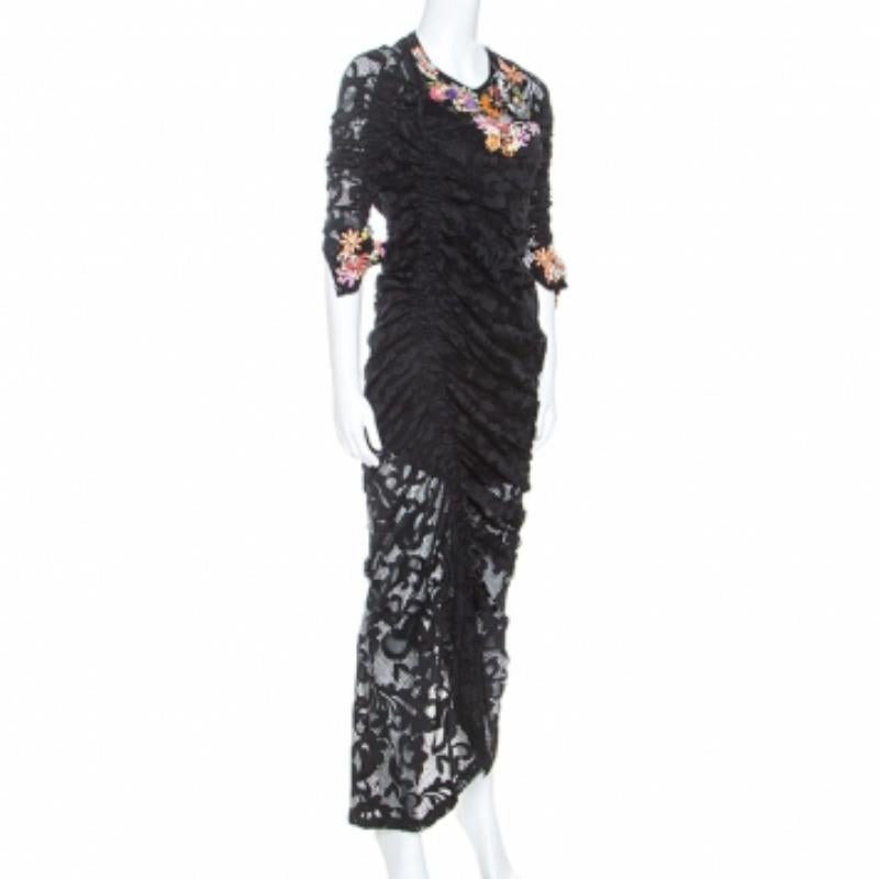 This black dress from Preen has a brilliant design, making it a must-have piece in your closet. This lace creation has a great fit, ruched details and embellishments. It is sure to be your companion season after season.