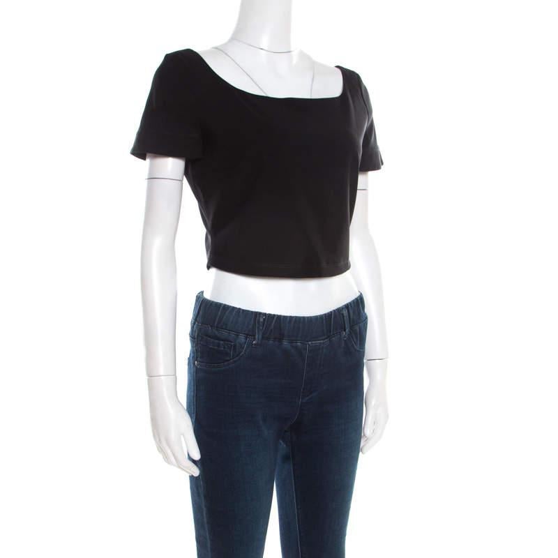 Every lady must have at least one crop top in her closet because they come in handy especially with high waist pants and skirts. This black piece is from Preen by Thornton Bregazzi, made with a mix of elastane to give it a shapely fit. It has short